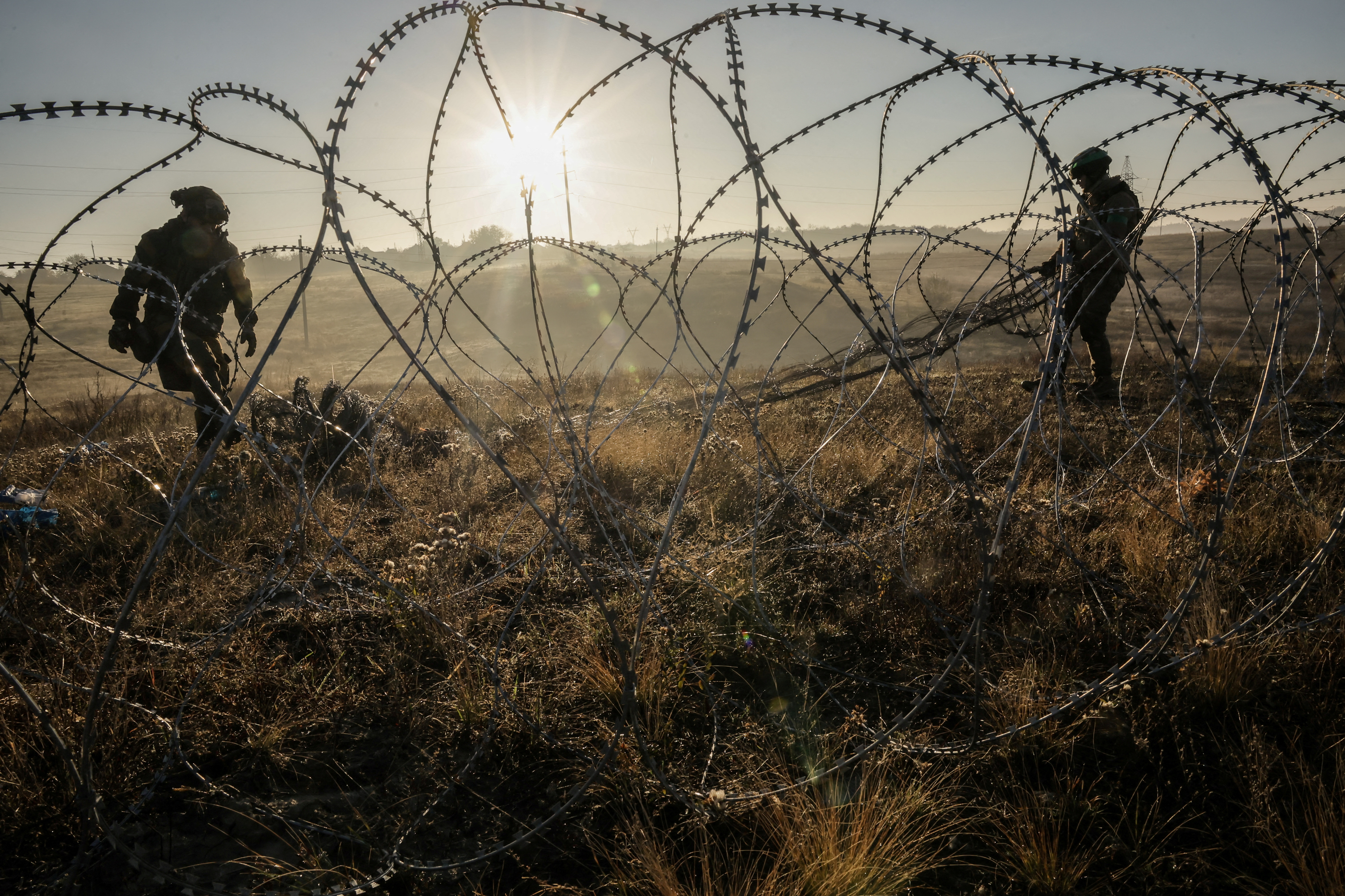 FILE PHOTO: Sappers install non-explosive obstacles along the front line on the outskirts of the town of Chasiv Yar