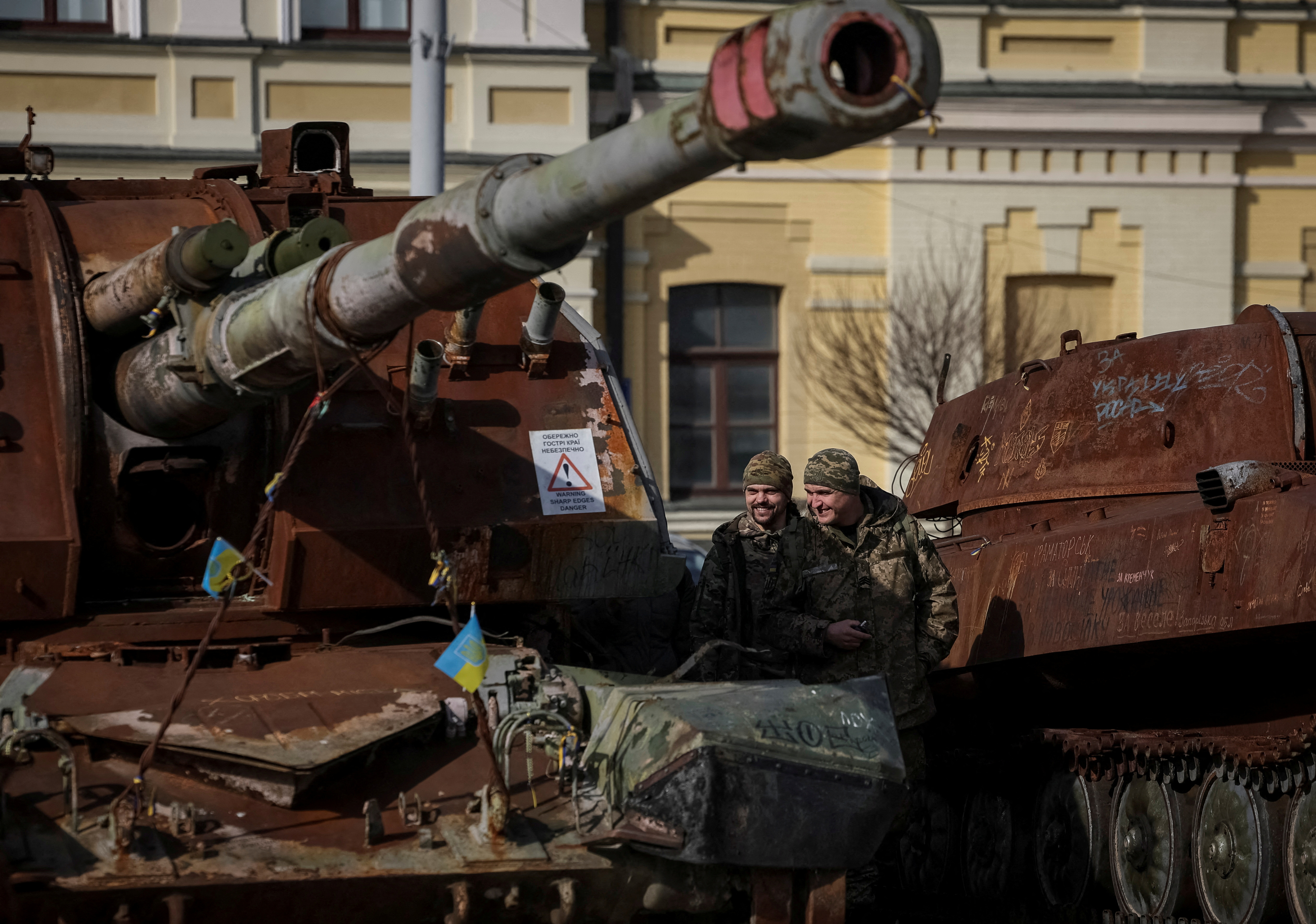 Ukrainian servicemen visit an exhibition displaying destroyed Russian military vehicles in central Kyiv