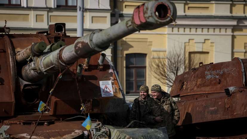 Ukrainian servicemen visit an exhibition displaying destroyed Russian military vehicles in central Kyiv