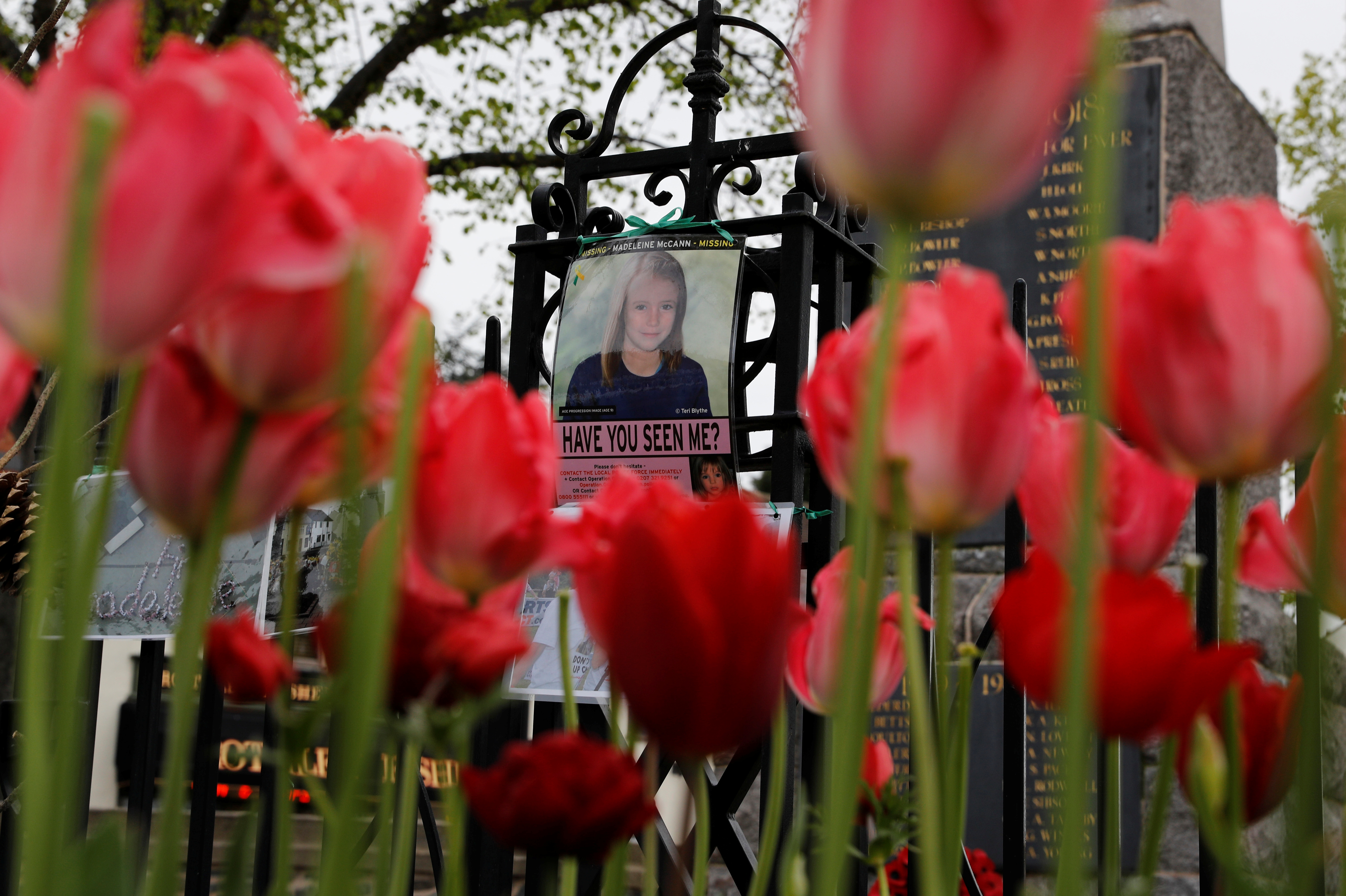 FILE PHOTO: An age progression image of Madeleine McCann hangs on a war memorial on the 11th anniversary of her disappearance from a holiday flat in Portugal, near her home in Rothley