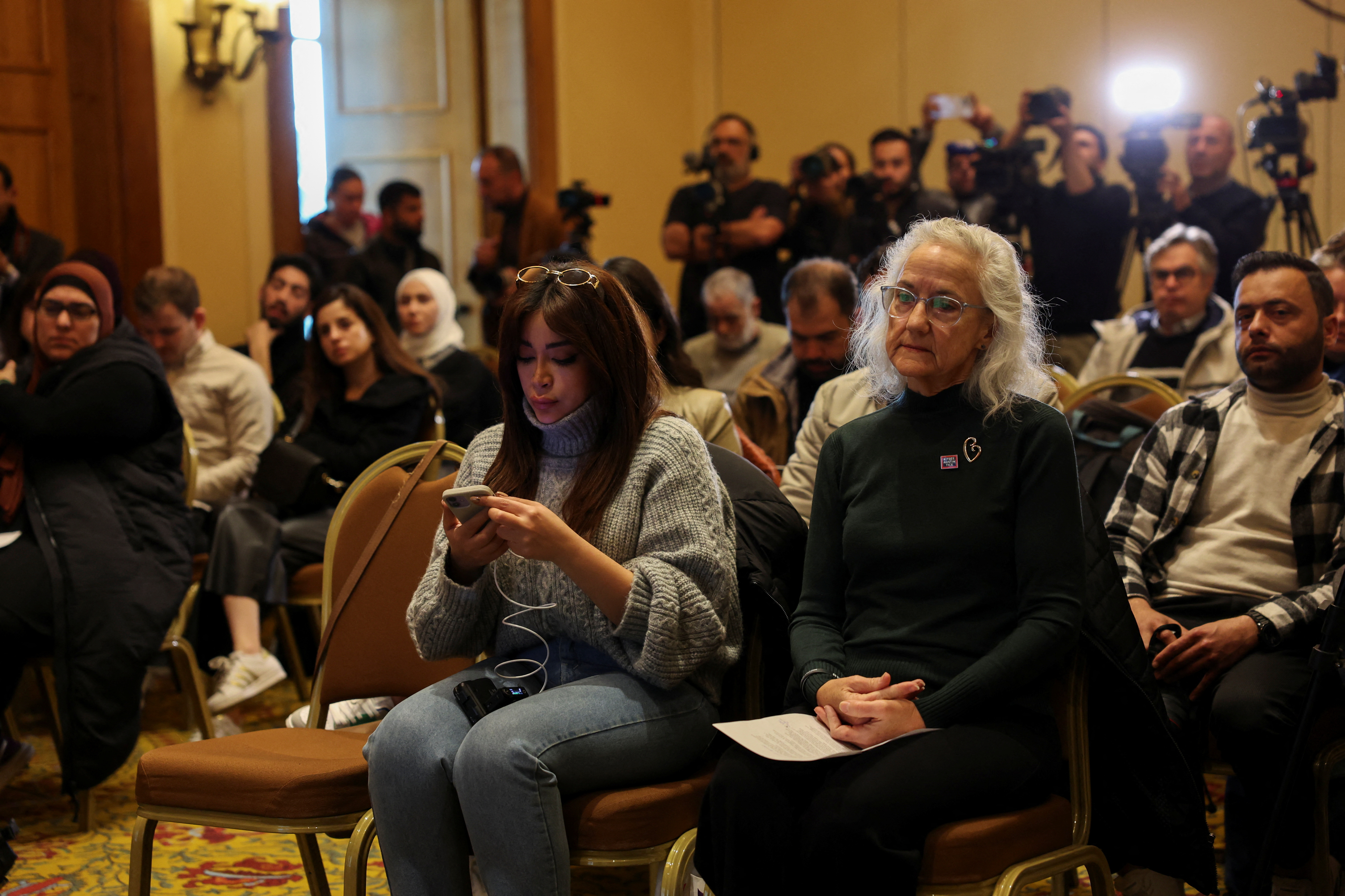 Debra Tice, mother of journalist Austin Tice sits near media workers before attending a press conference in Damascus