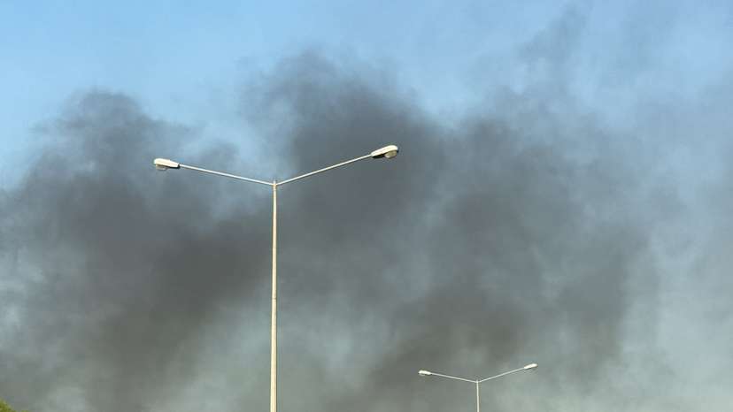 Smoke rises after several blasts were heard in Doha