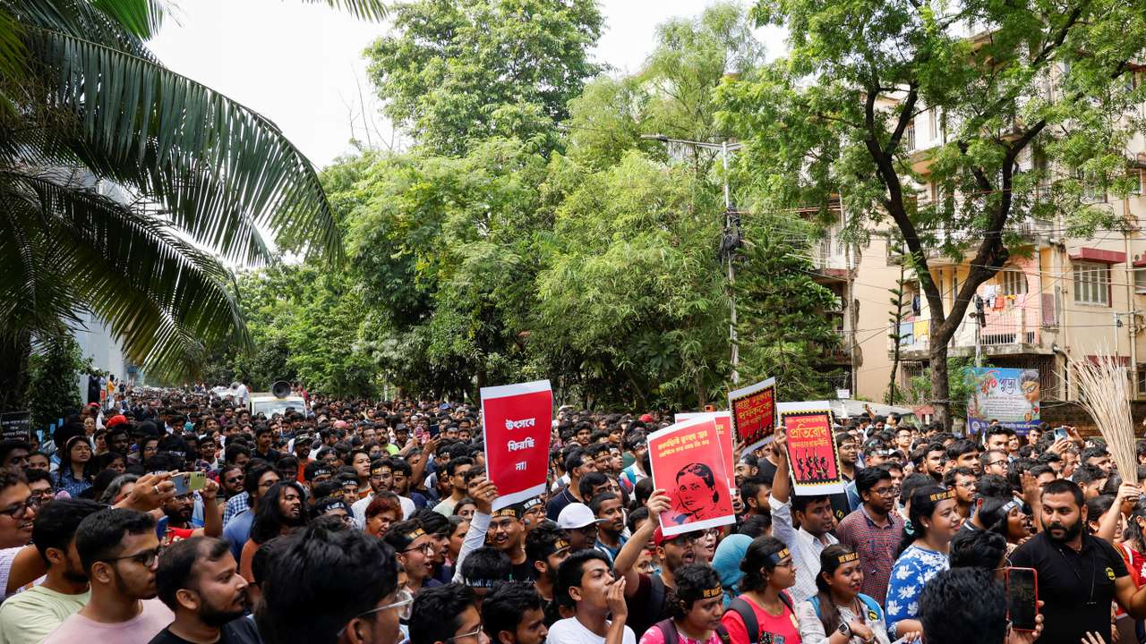 Medics march along a street during a protest condemning the rape and murder of a trainee medic at a government-run hospital, in Kolkata