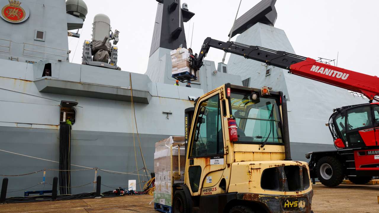 Supplies are loaded on HMS Dragon as it prepares to deploy to the Mediterranean, in Portsmouth