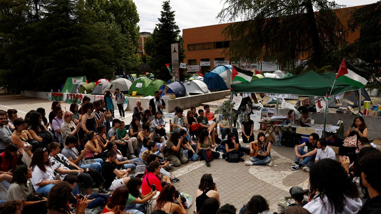 People gather at a pro-Palestinian encampment by students of the Complutense University in Madrid