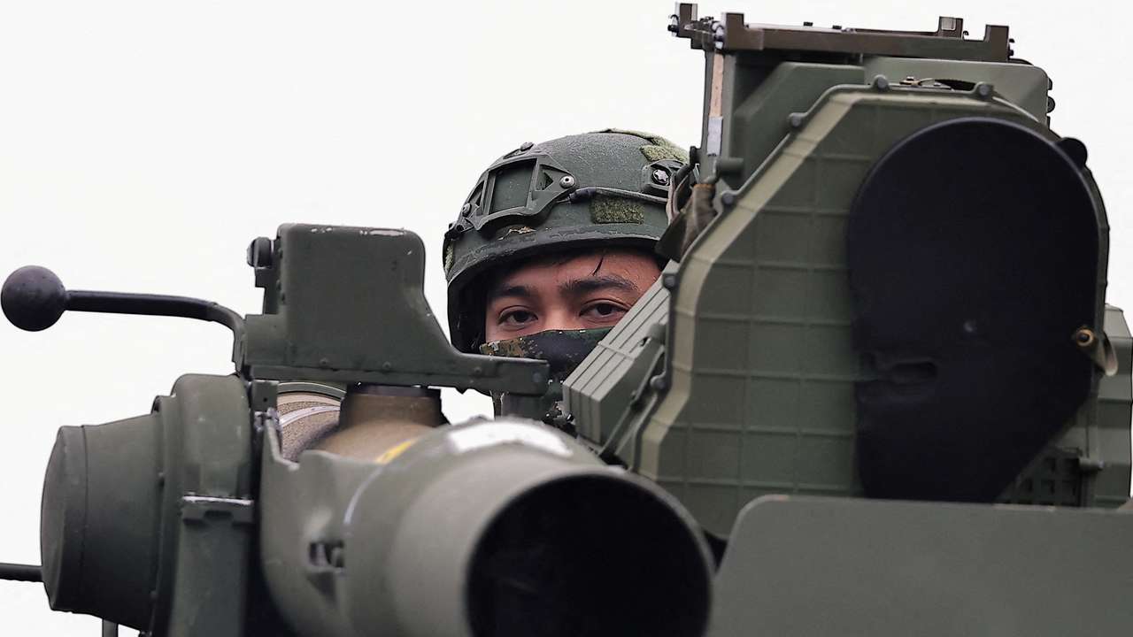 FILE PHOTO: A soldier stands on an M1167 TOW carrier vehicle at the Fangshan training grounds in Pingtung