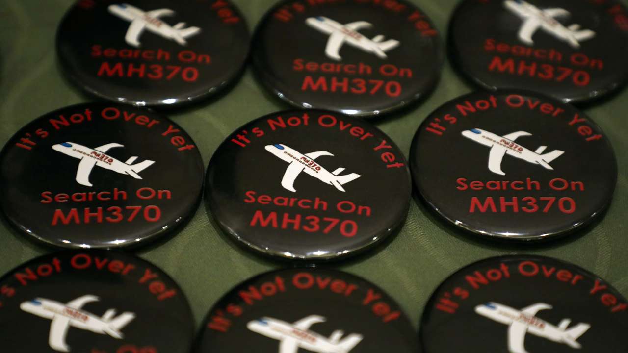 Badges are displayed during the sixth annual remembrance event for the missing Malaysia Airlines flight MH370 in Putrajaya