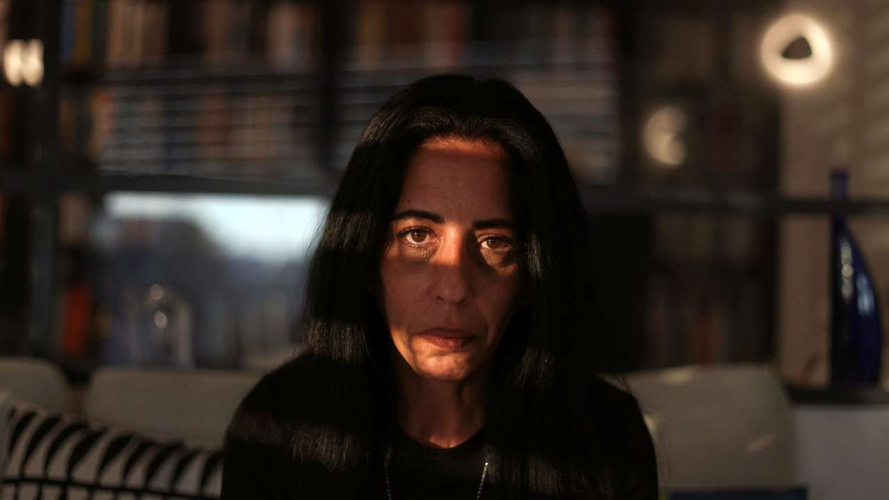 Einav Zangauker, mother of Israeli hostage Matan Zangauker who was seized by Hamas on October 7 and remains in Gaza, sits in her living room during an interview with Reuters, in Tel Aviv