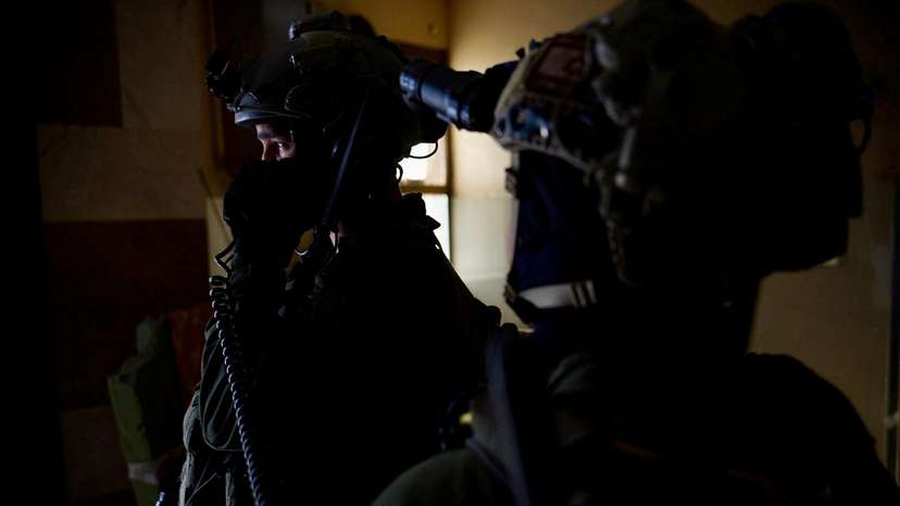 Israeli soldiers operate in a location given as Nasser Hospital in Gaza