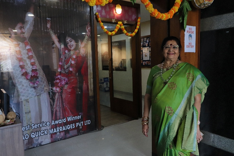 Vanaja Rao, owner of a matchmaking agency, poses for a picture in front of her office, in Hyderabad