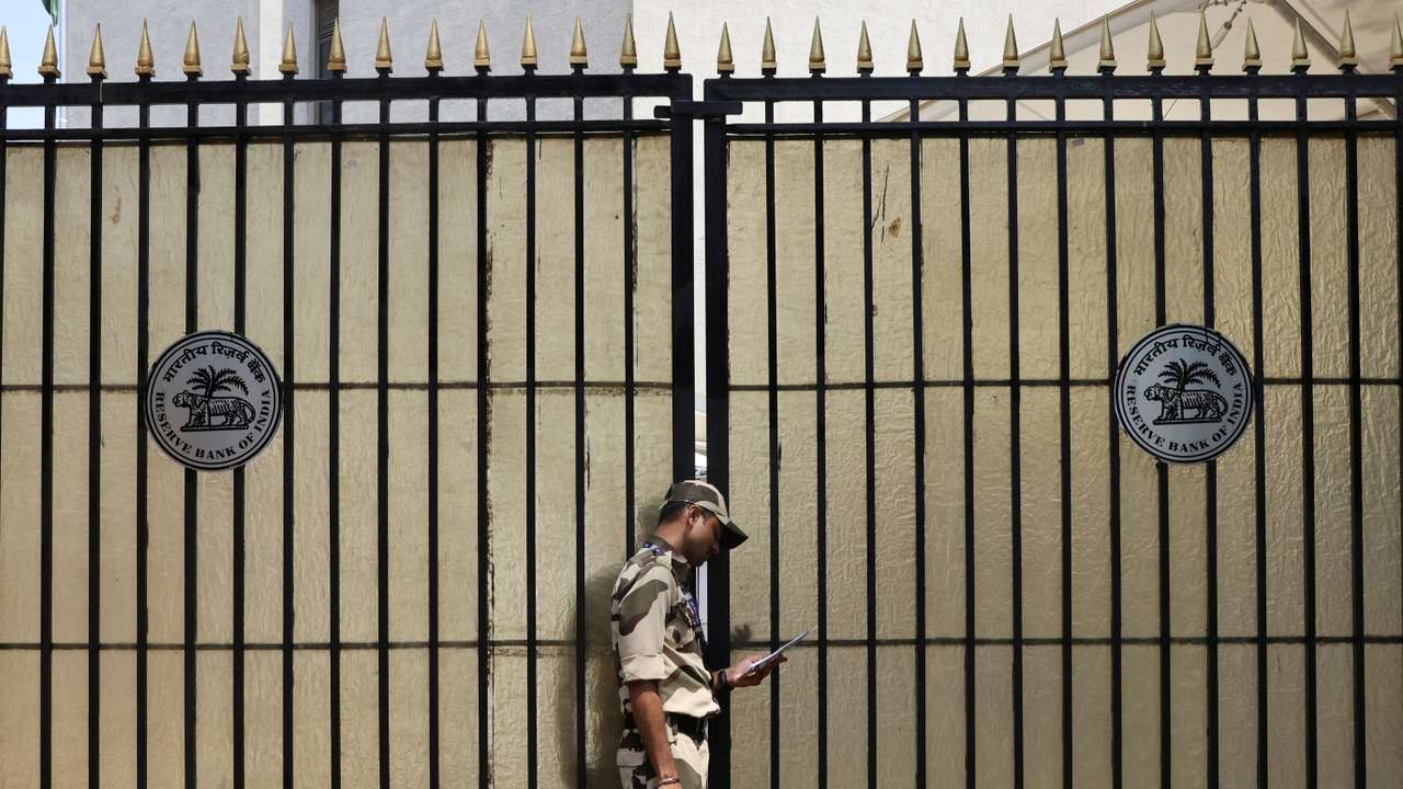 A guard stands outside the gate of the Reserve Bank of India (RBI) headquarters in Mumbai