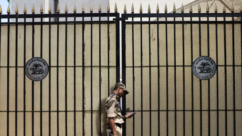 A guard stands outside the gate of the Reserve Bank of India (RBI) headquarters in Mumbai