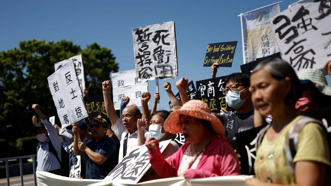 Longtan residents take part in a protest against the expansion of an industrial park for advanced chip manufacturing in Taoyuan, near the presidential office in Taipei