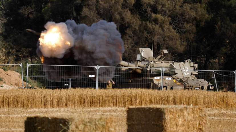 FILE PHOTO: An Israeli mobile artillery unit fires towards Gaza, near the Israel-Gaza border