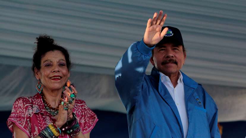 FILE PHOTO: Nicaragua's President Ortega and Vice President Rosario Murillo greet supporters during an event to commemorate the 40th anniversary of the taking of the national palace by Sandinistas guerrilla in Managua