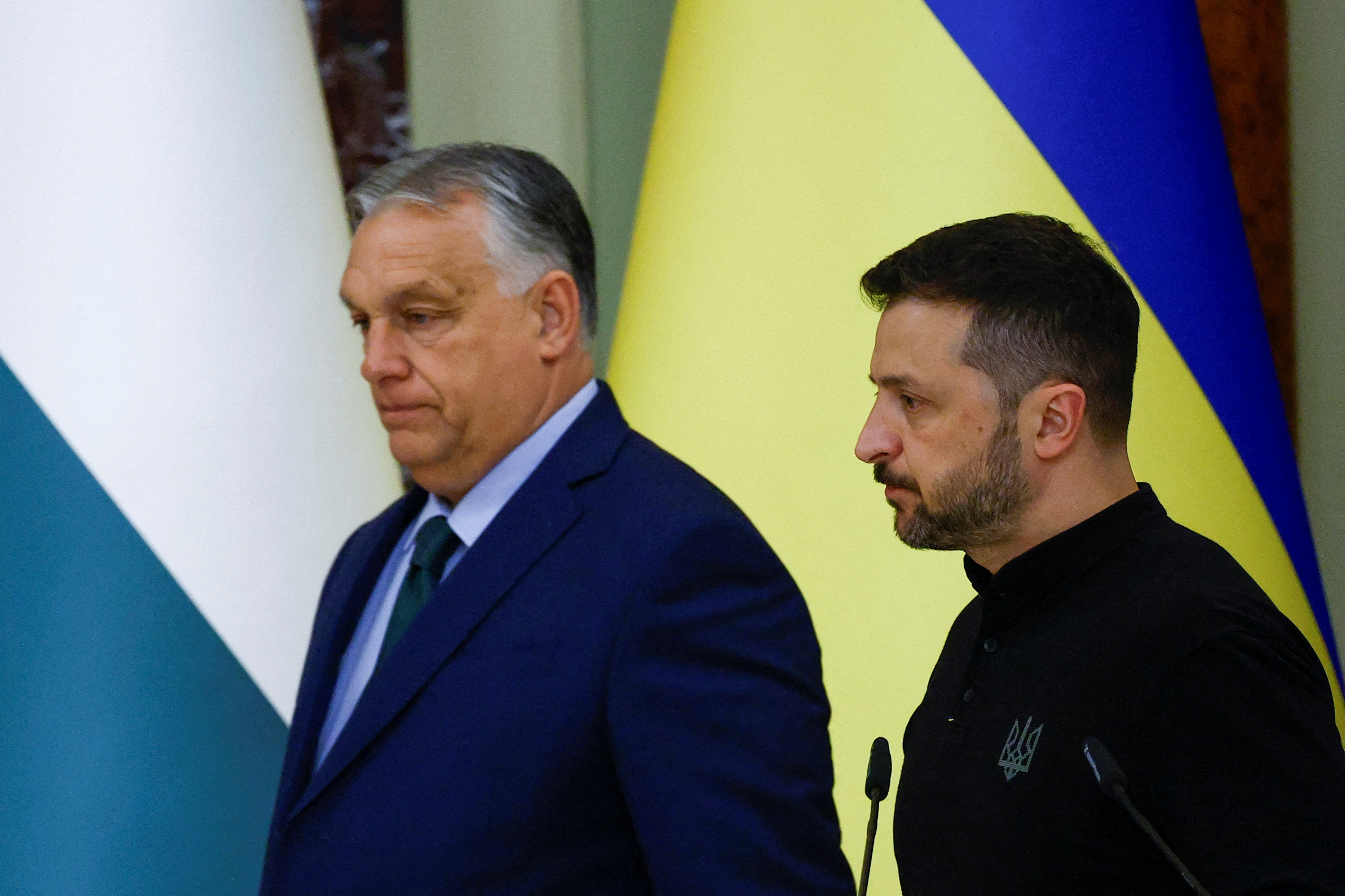 FILE PHOTO: Hungary's Prime Minister Viktor Orban and Ukrainian President Volodymyr Zelenskiy arrive for a joint news briefing in Kyiv