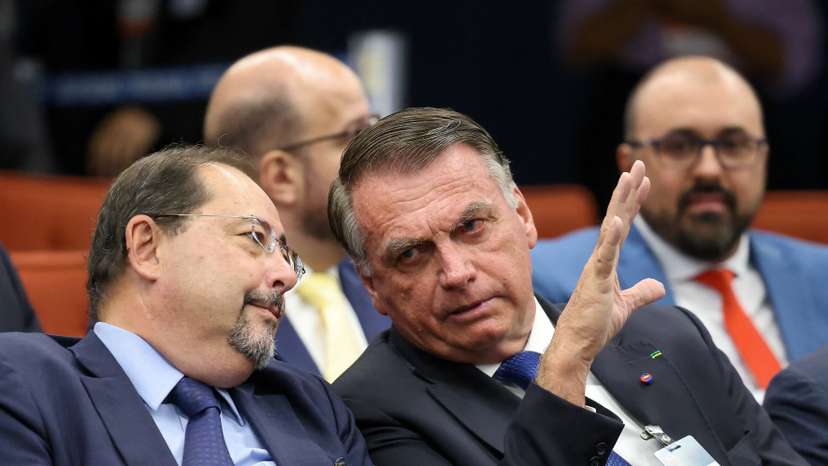 Brazil's former President Bolsonaro attends a session of the Supreme Court as it deliberates if he and some of his closest aides should stand trial for allegedly attempting a coup, in Brasilia