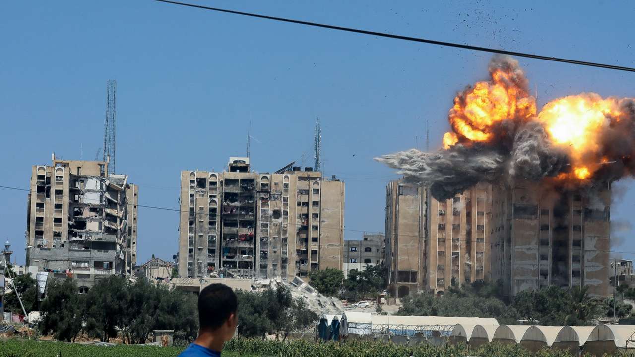 Explosion following an Israeli air strike on a residential building, amid the Israel-Hamas conflict, in Nuseirat