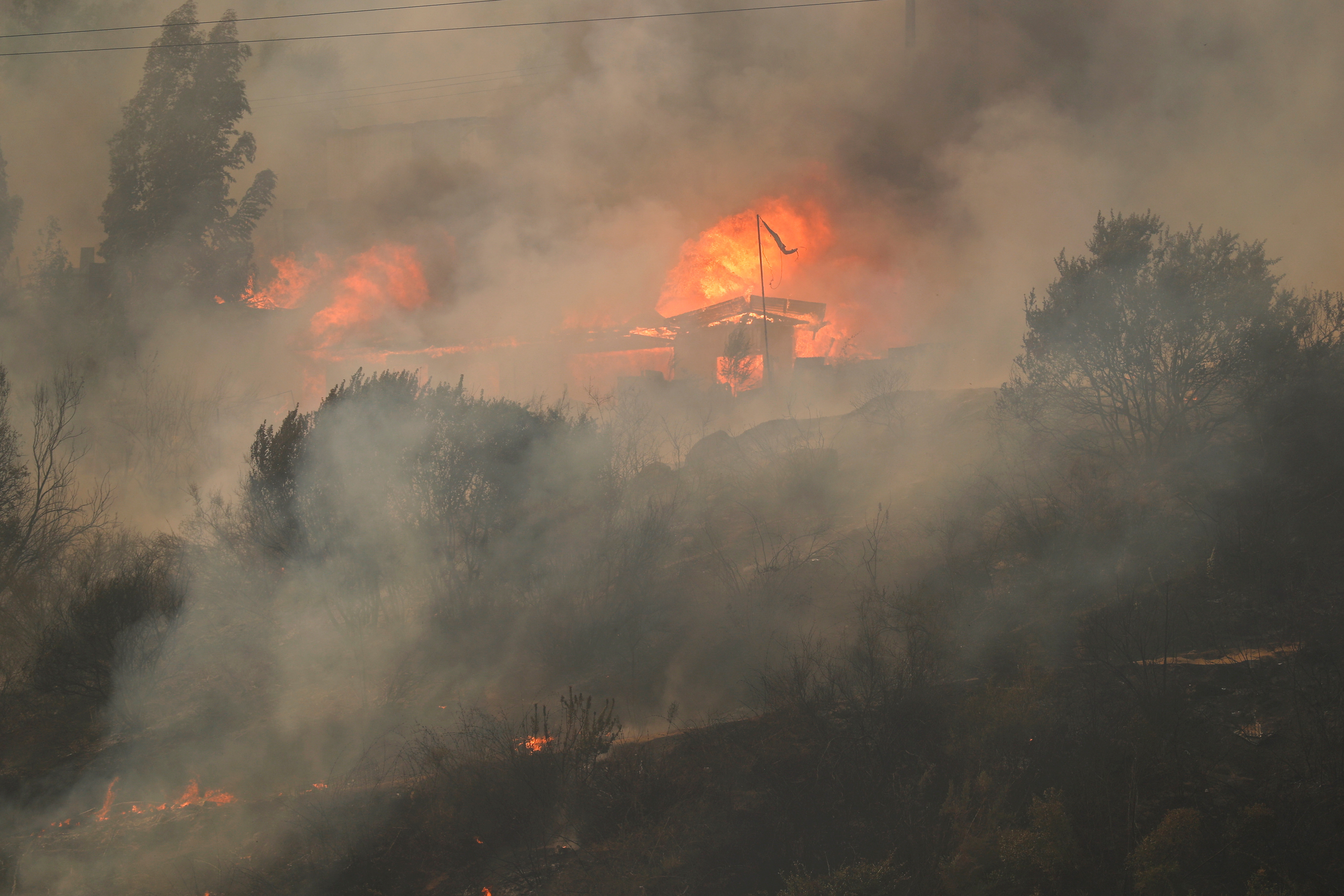 A view shows a fire, following the spread of wildfires in Vina del Mar