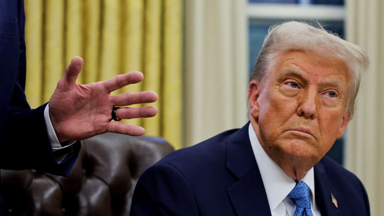 U.S. President Donald Trump signs an executive order in the Oval Office at the White House