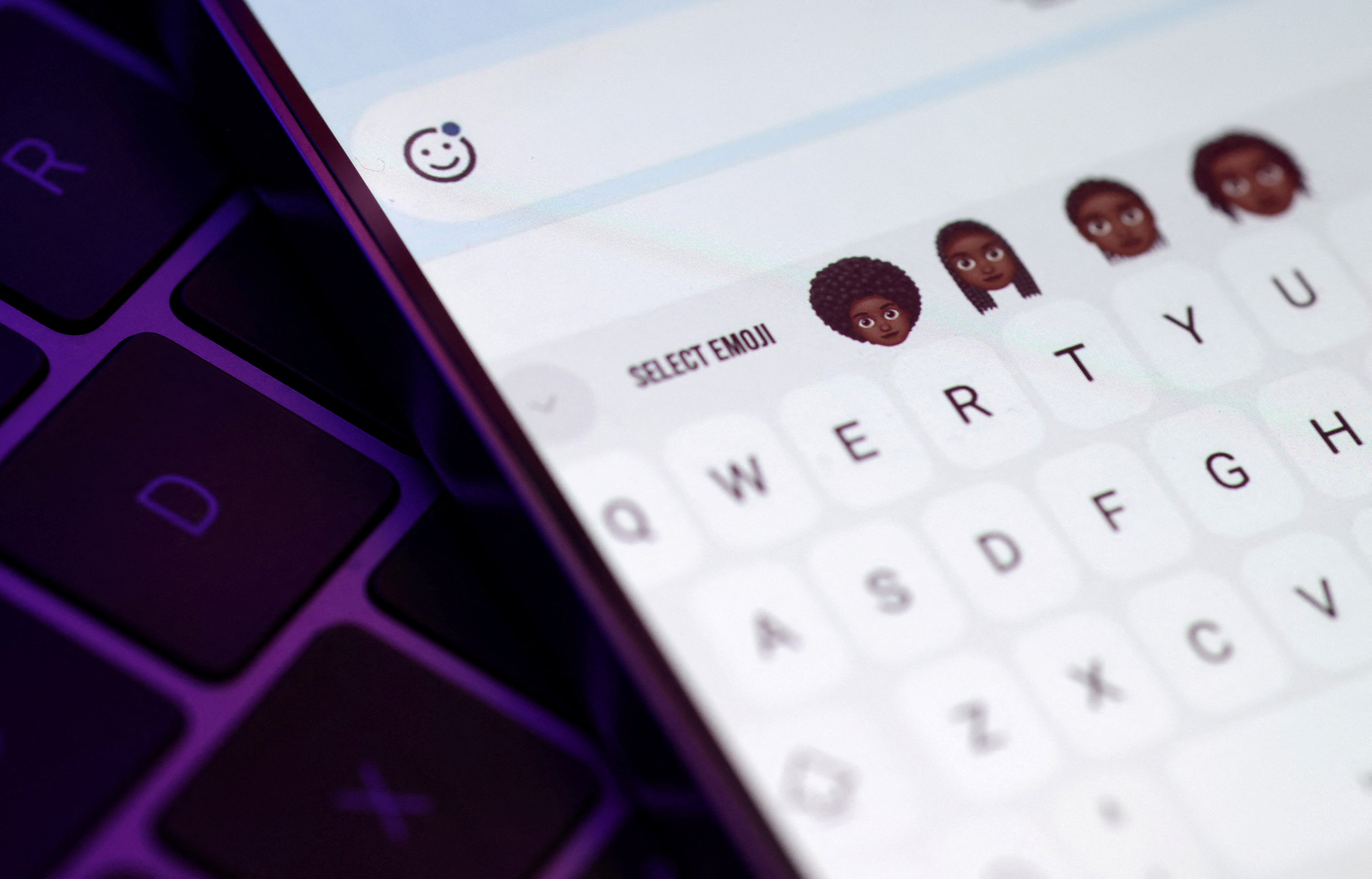 Emojis featuring cornrows, locs, braids and afro hair, drawn by Rise.365 members and digitalised by Good Relations Junior Designer, Vanita Brown are seen on smartphone
