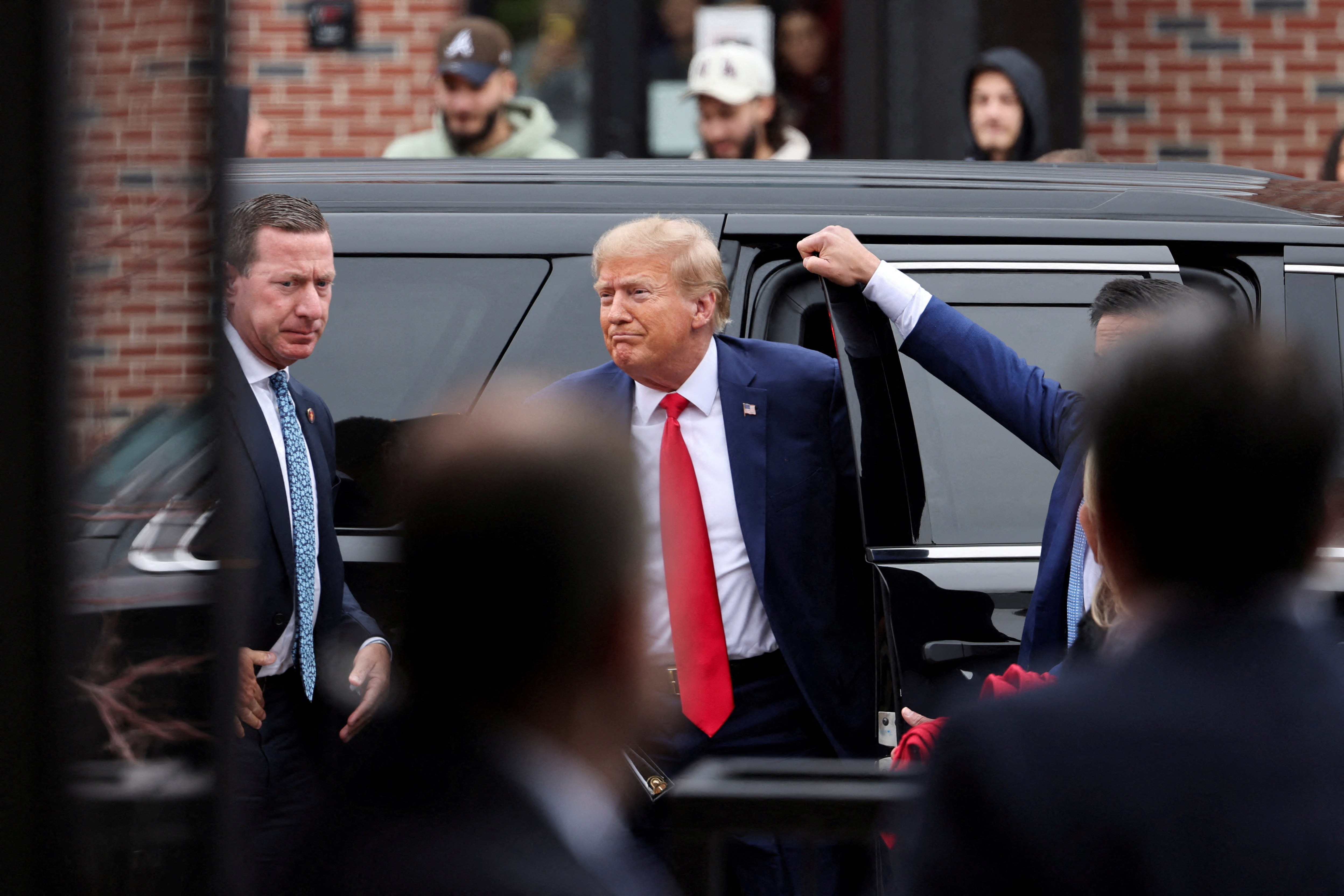 FILE PHOTO: Former U.S. President and Republican presidential candidate Donald Trump attends a "commit to caucus" event, in Ankeny