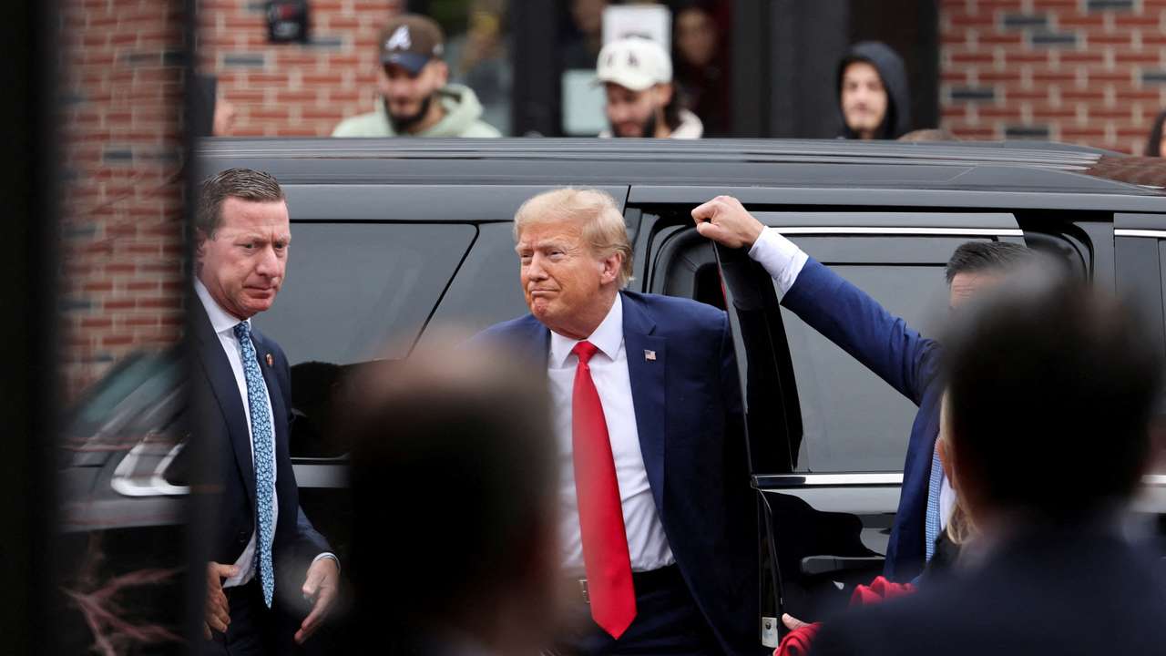 FILE PHOTO: Former U.S. President and Republican presidential candidate Donald Trump attends a "commit to caucus" event, in Ankeny