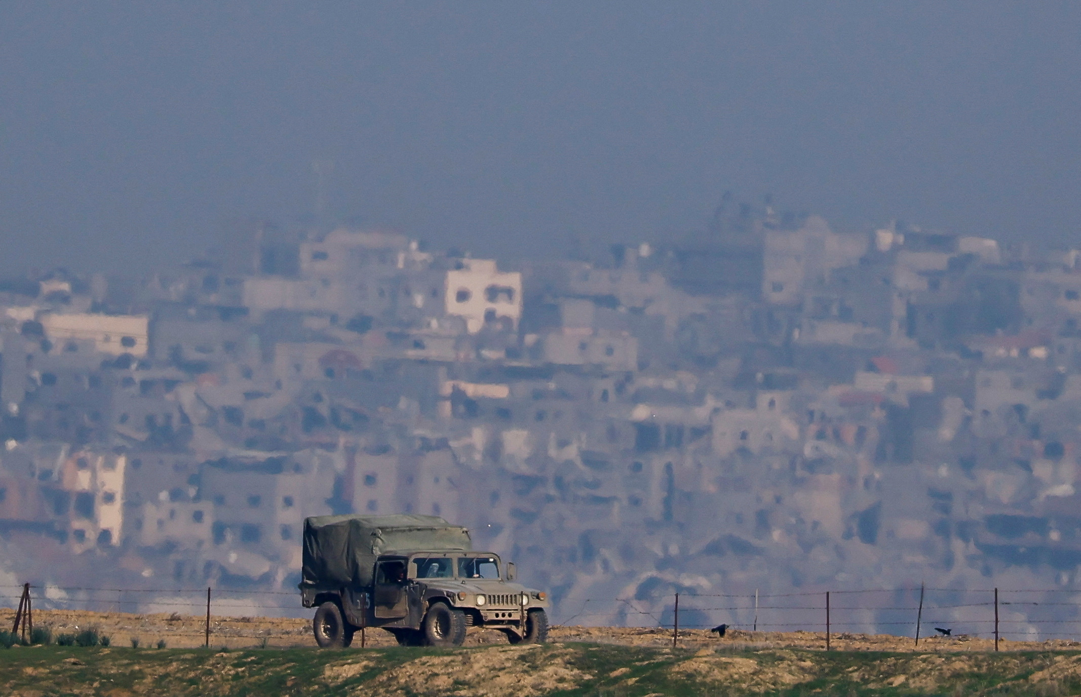 An Israeli military vehicle operates, as seen from Southern Israel