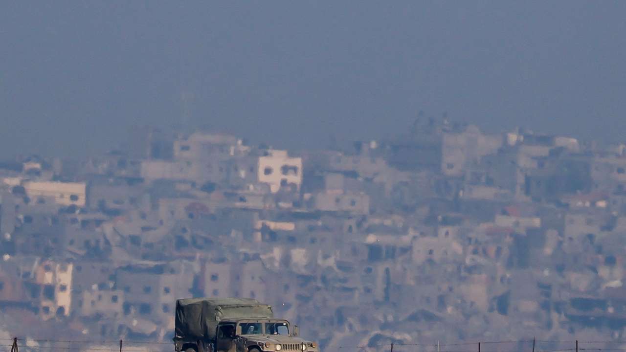 An Israeli military vehicle operates, as seen from Southern Israel
