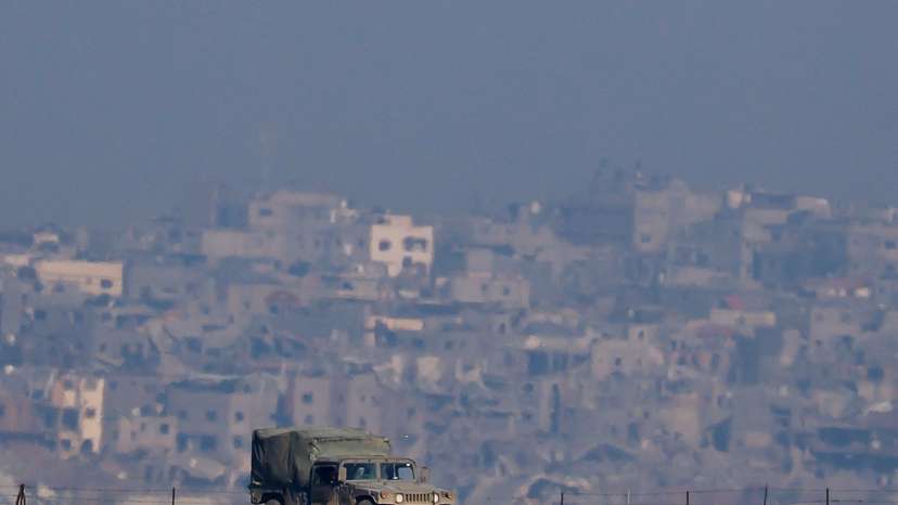 An Israeli military vehicle operates, as seen from Southern Israel