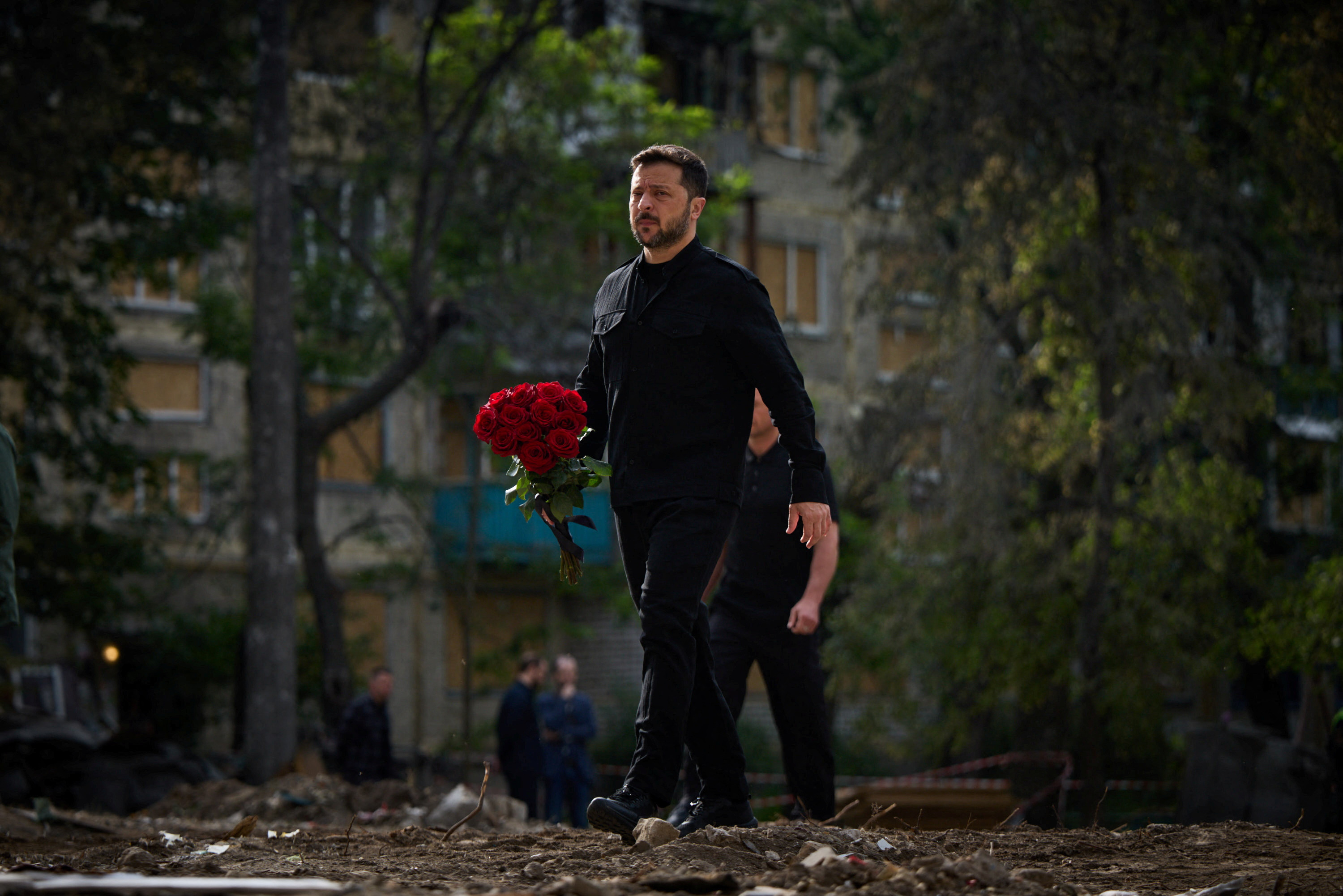 Ukraine's President Zelenskiy pays tribute to victms of a recent Russian drone and missile attack in Kyiv