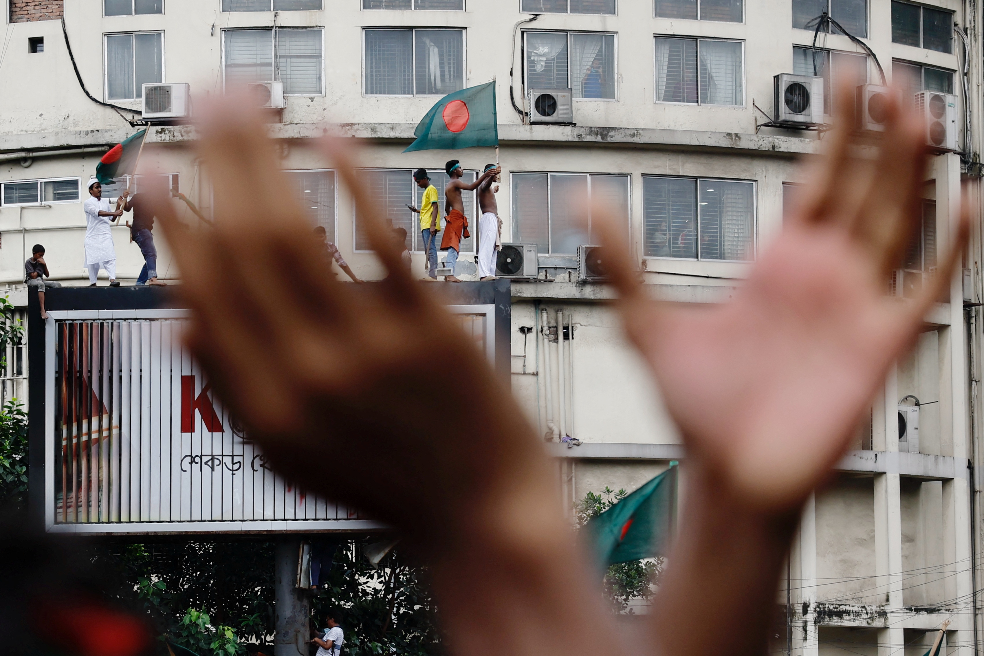 People celebrate the resignation of Bangladeshi Prime Minister Hasina in Dhaka