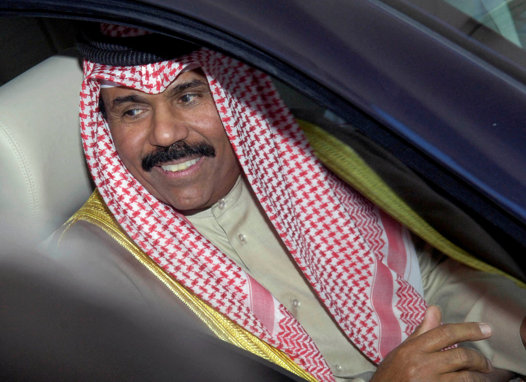 FILE PHOTO: Kuwait's Crown Prince Sheikh Nawaf leaves Parliament in Kuwait