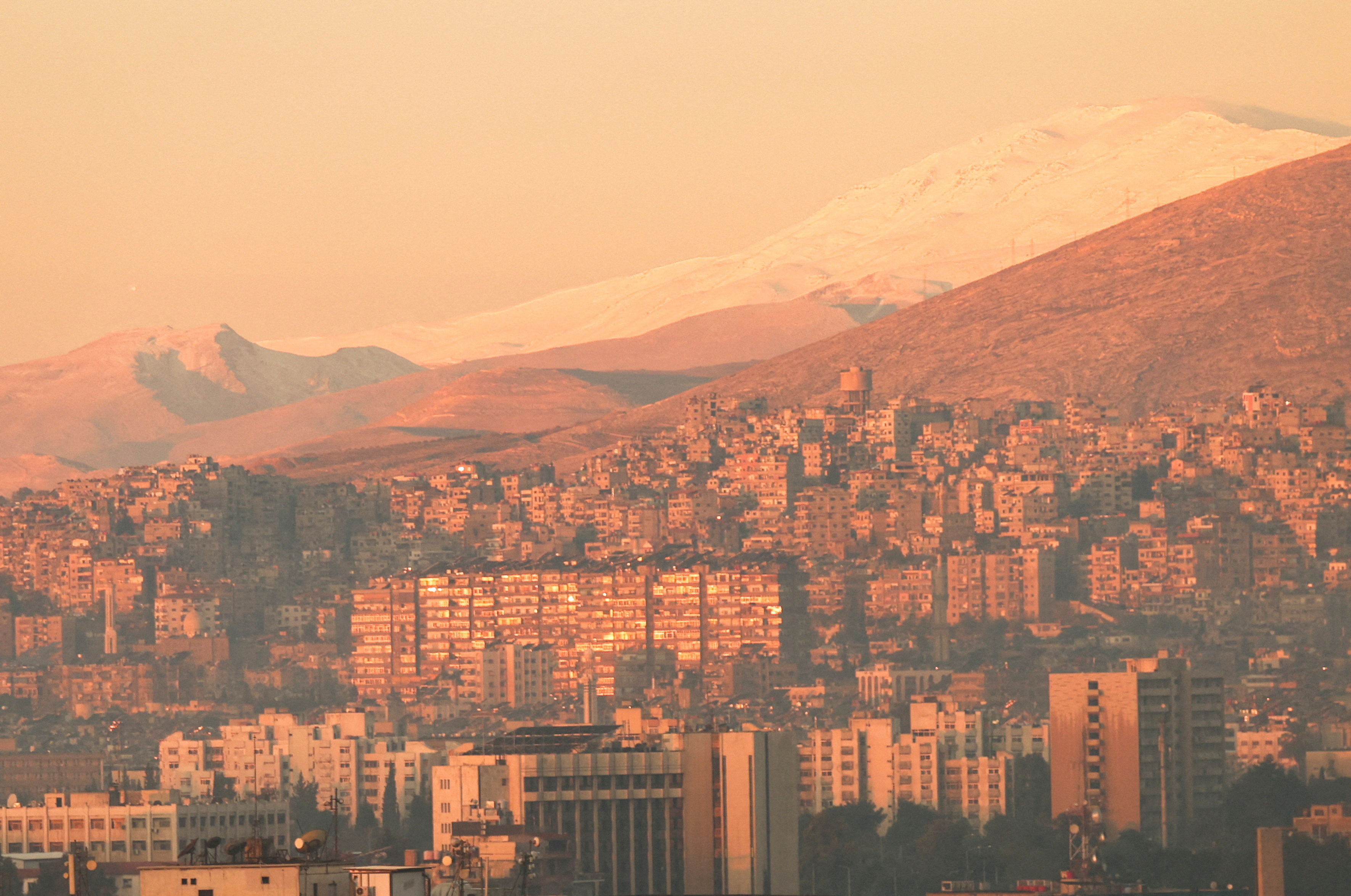 FILE PHOTO: A general view of the city during the year's first sunrise on New Year's Day, in Damascus