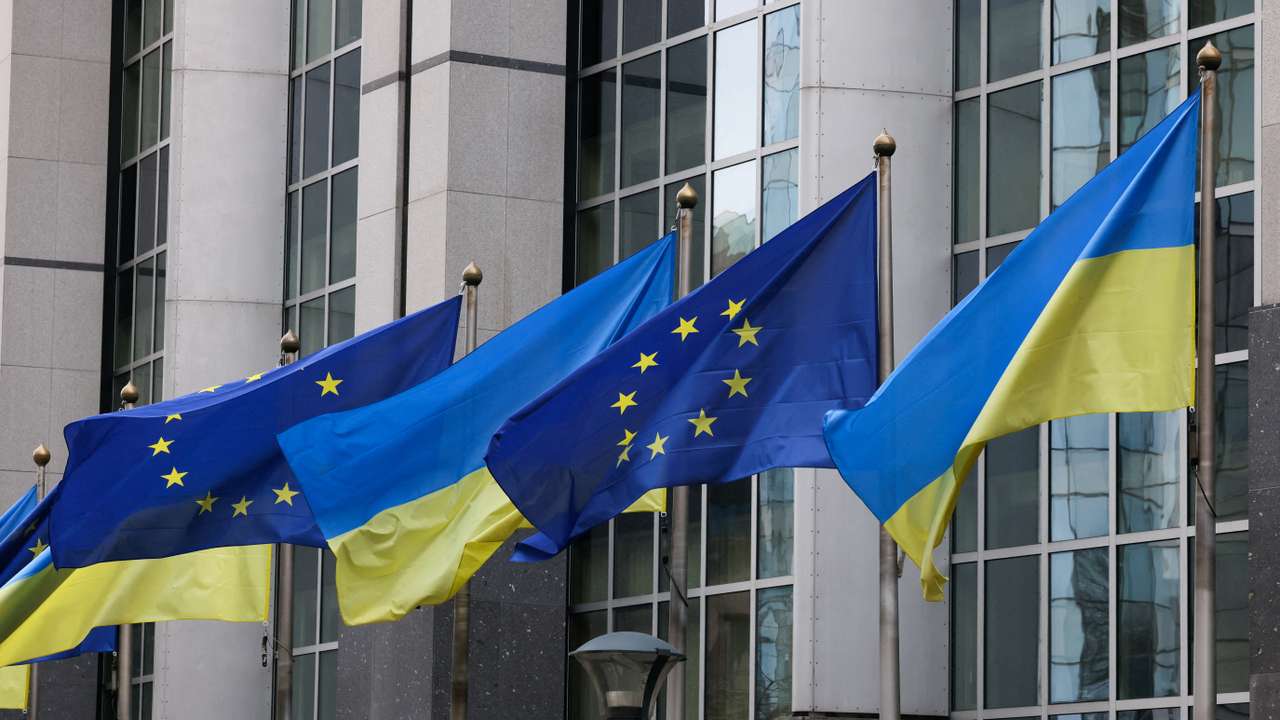 FILE PHOTO: Flags of Ukraine fly in front of the EU Parliament building on the first anniversary of the Russian invasion