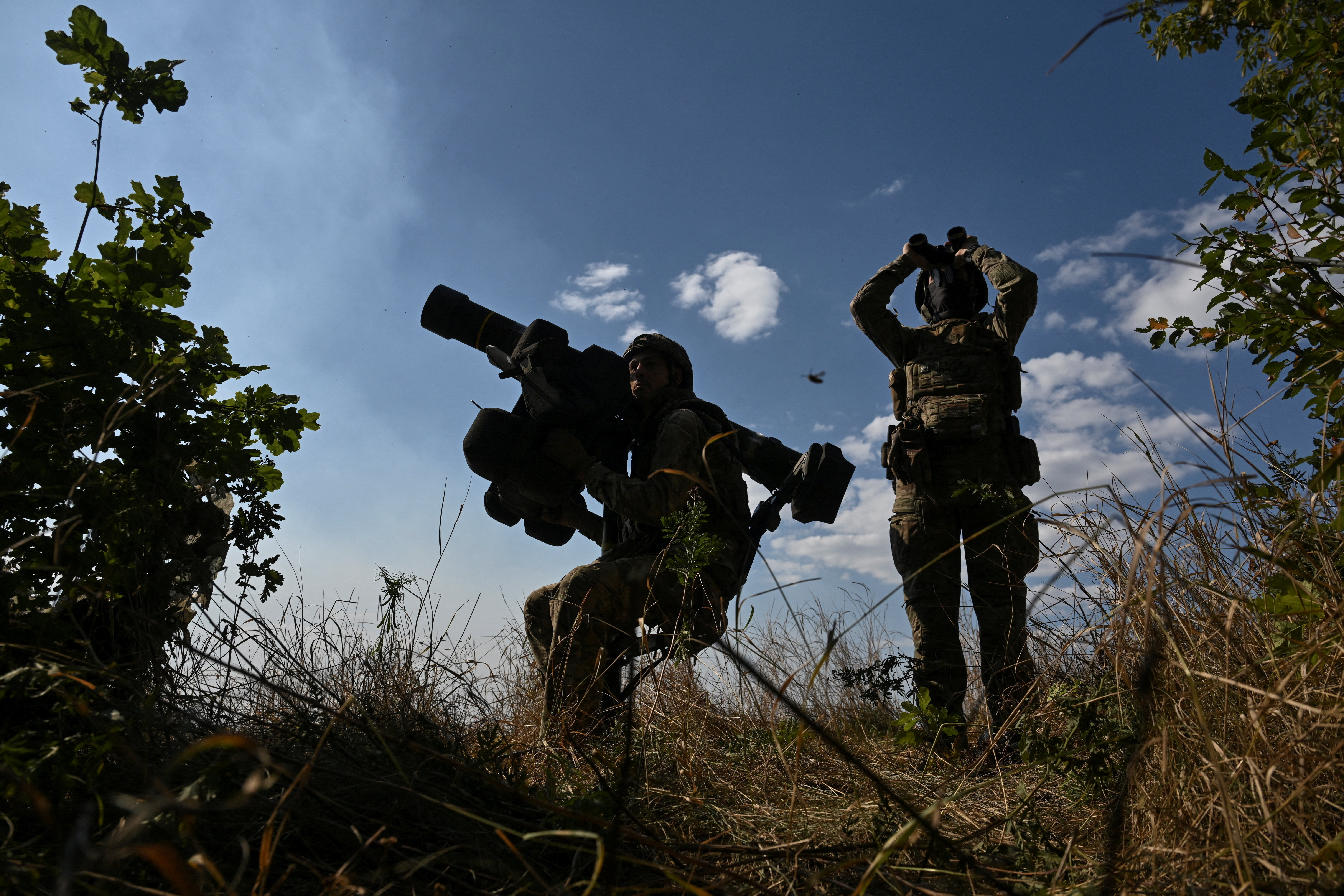 FILE PHOTO: Ukrainian servicemen observe the sky during a combat shift in a front line in Kharkiv region