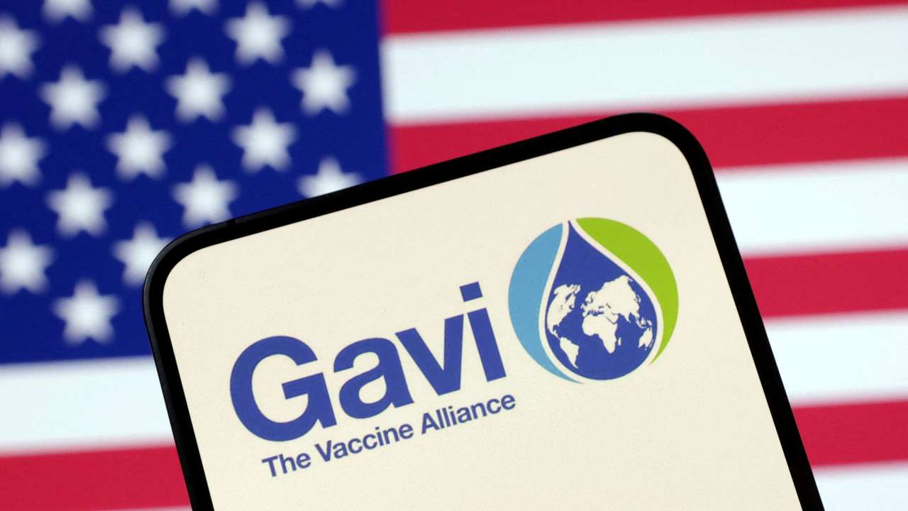 FILE PHOTO: Illustration shows The Vaccine Alliance (GAVI) logo and U.S. flag