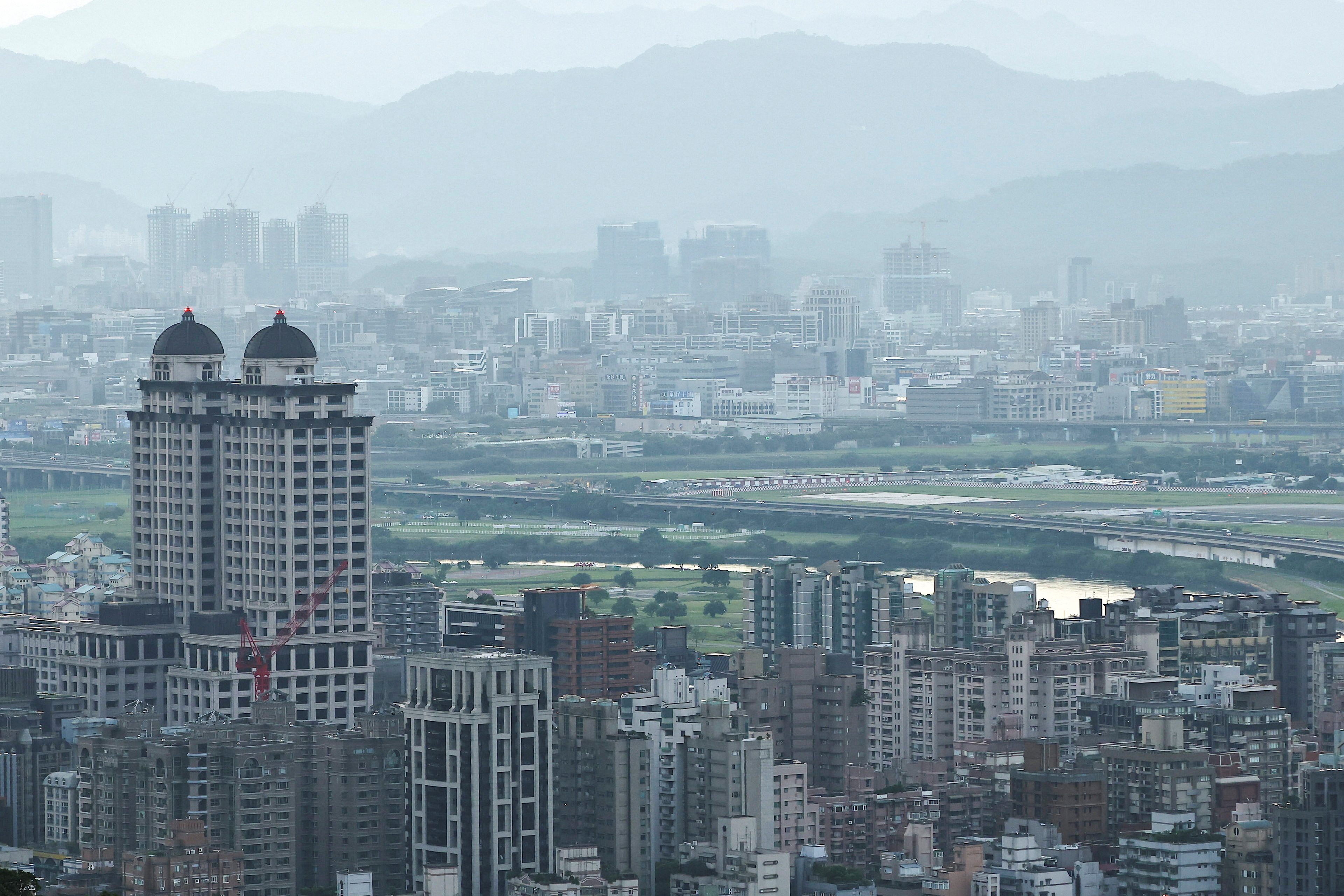 FILE PHOTO: A general view of Taipei skyline during sunrise in Taipei