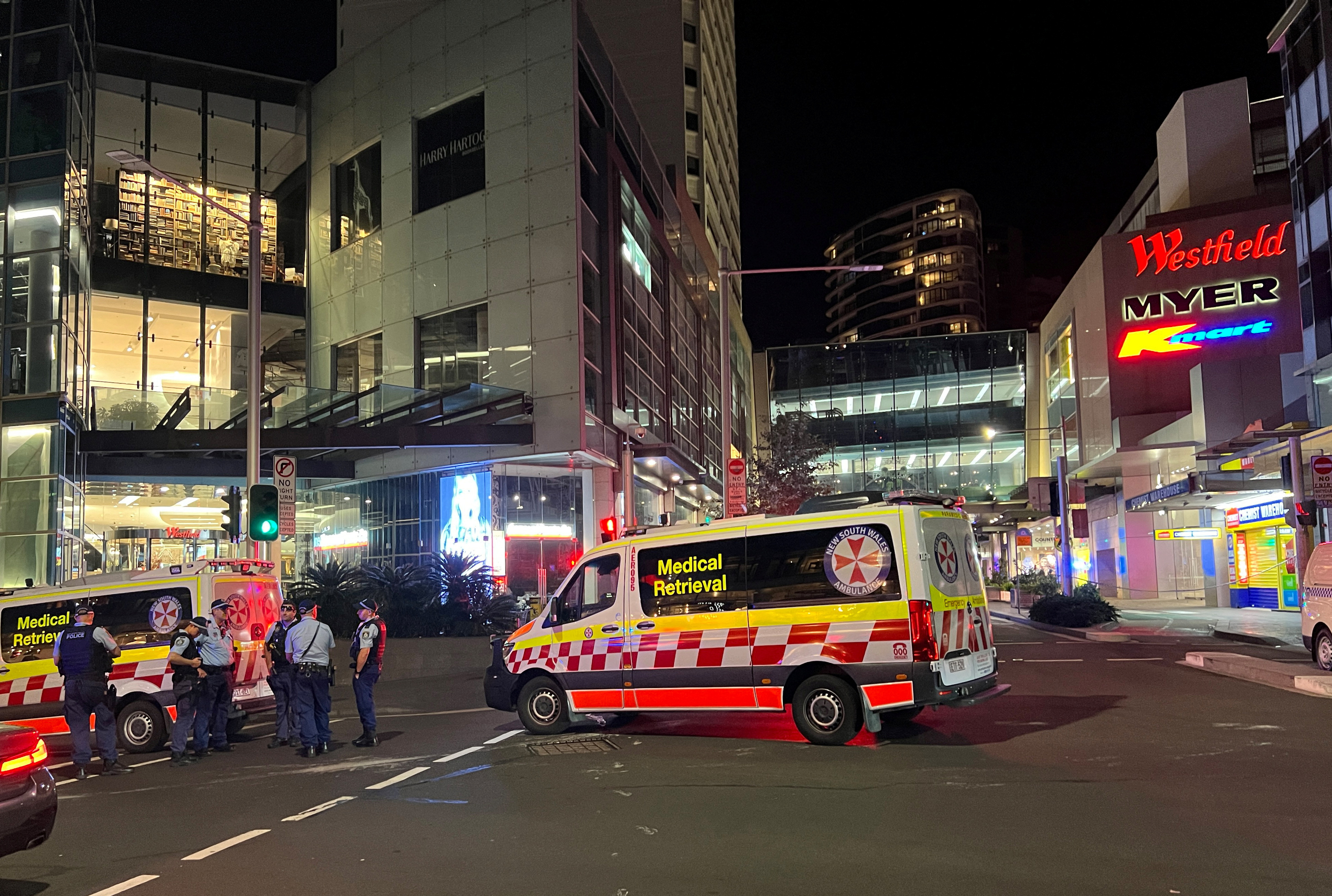 Police officers work at the scene outside Bondi Junction following reports of stabbings in the mall, in Sydney