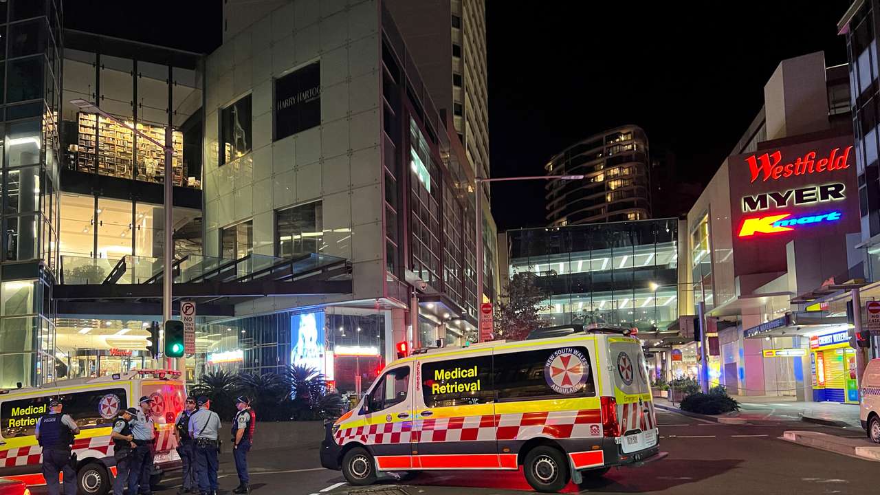Police officers work at the scene outside Bondi Junction following reports of stabbings in the mall, in Sydney