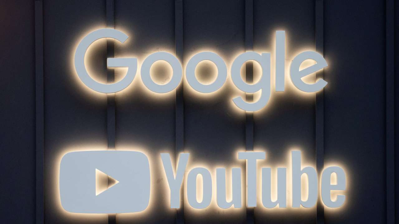 FILE PHOTO: The logos of Google and YouTube are seen in Davos