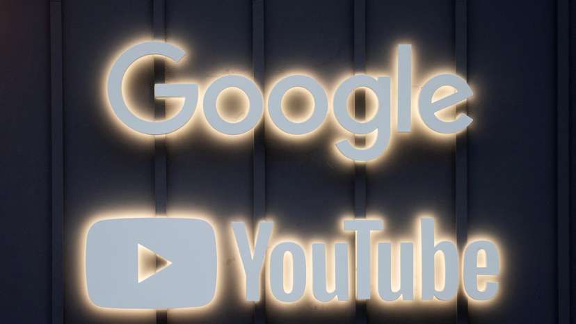 FILE PHOTO: The logos of Google and YouTube are seen in Davos