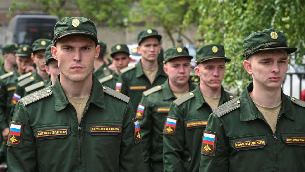 FILE PHOTO: Russian conscripts called up for military service depart from a recruitment centre in Bataysk