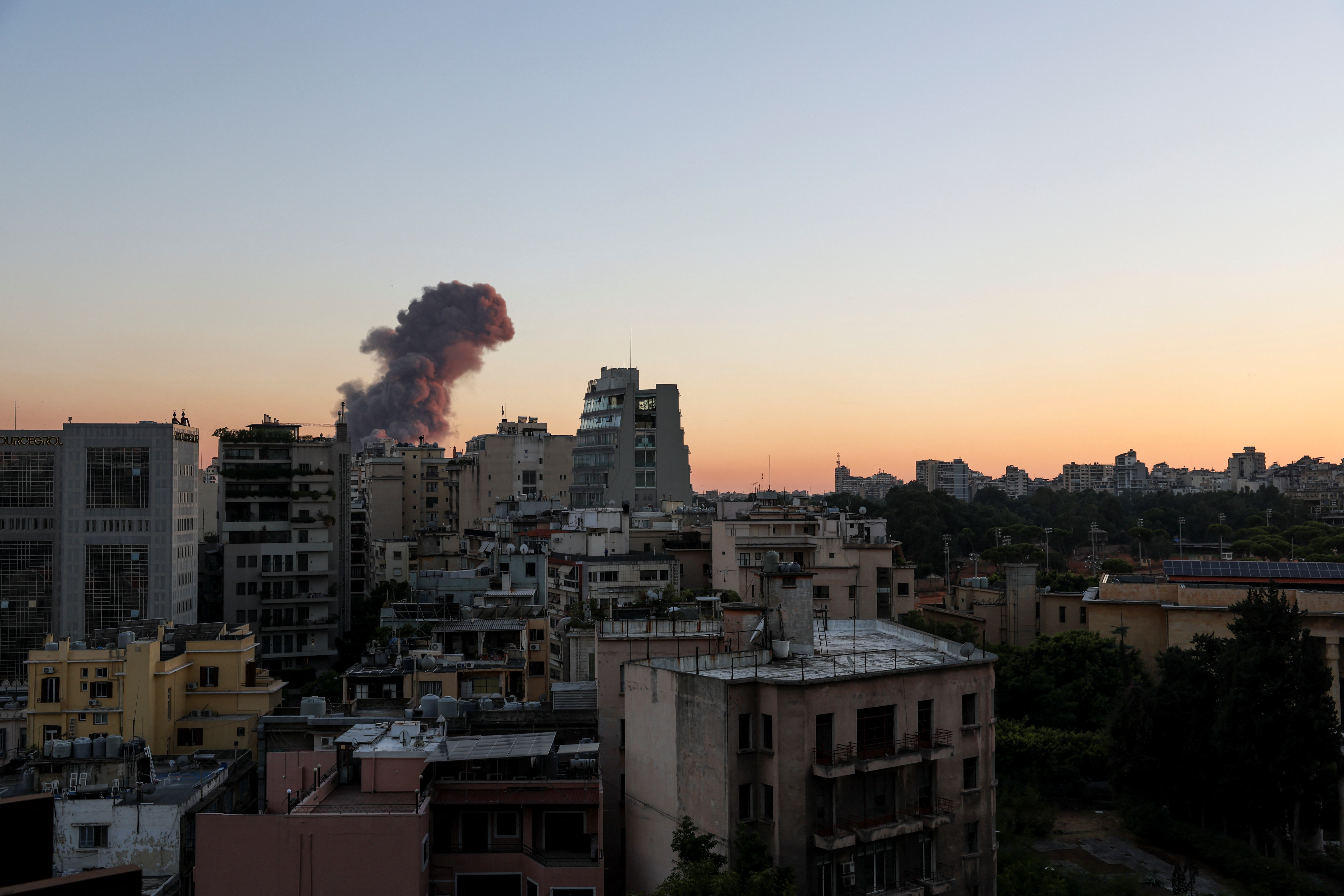 Smoke rises after explosions in Beirut