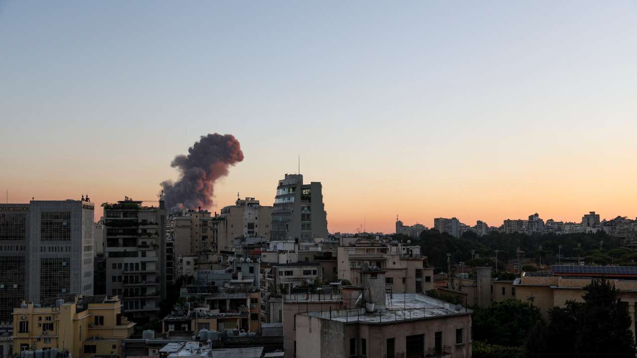Smoke rises after explosions in Beirut