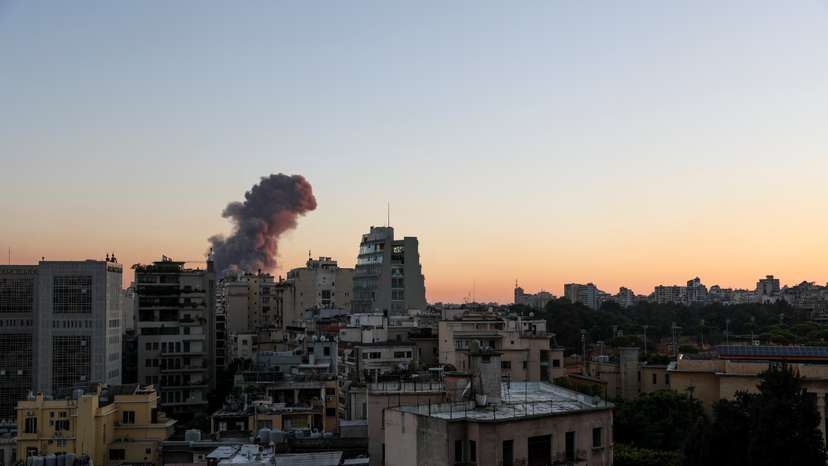 Smoke rises after explosions in Beirut