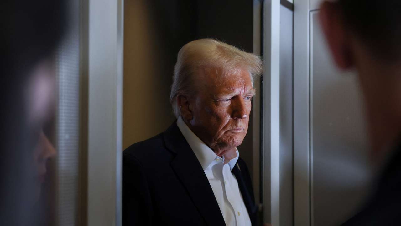 U.S. President Trump speaks to reporters aboard Air Force One on his way to Miami
