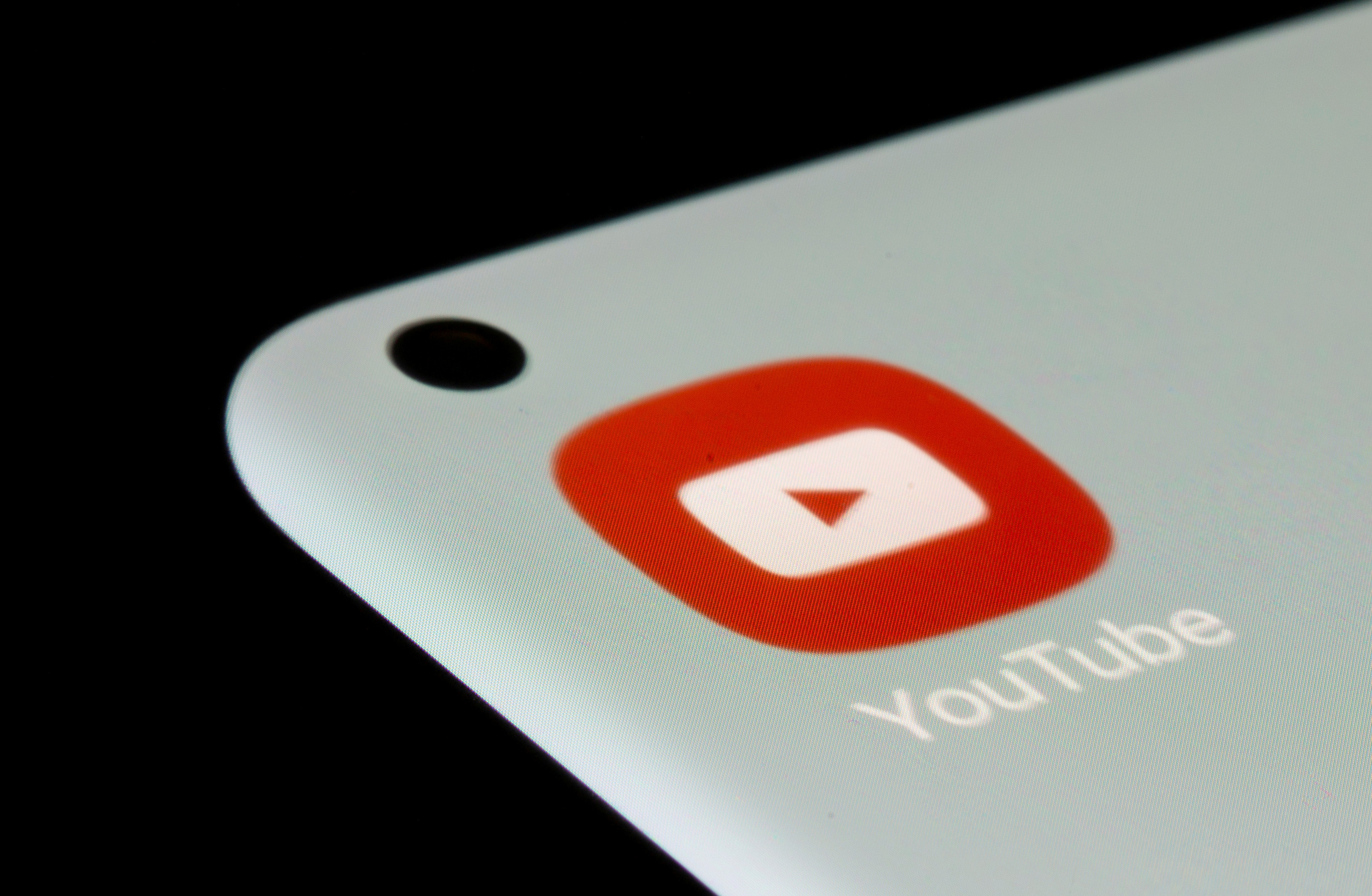 YouTube app is seen on a smartphone in this illustration
