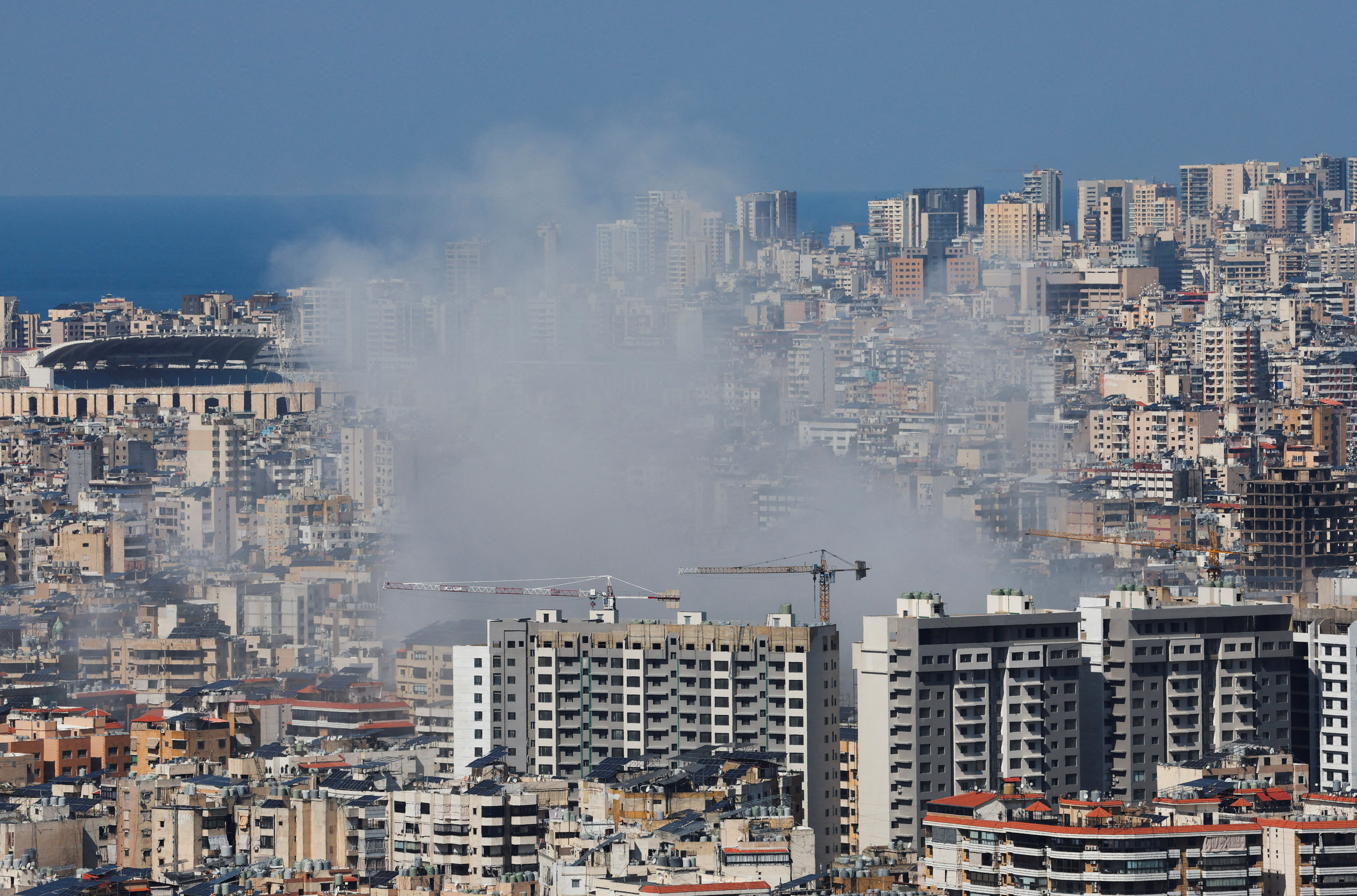 Smoke rises after an Israeli strike on Beirut's southern suburbs, following an escalation between Hezbollah and Israel amid the U.S.-Israel conflict with Iran