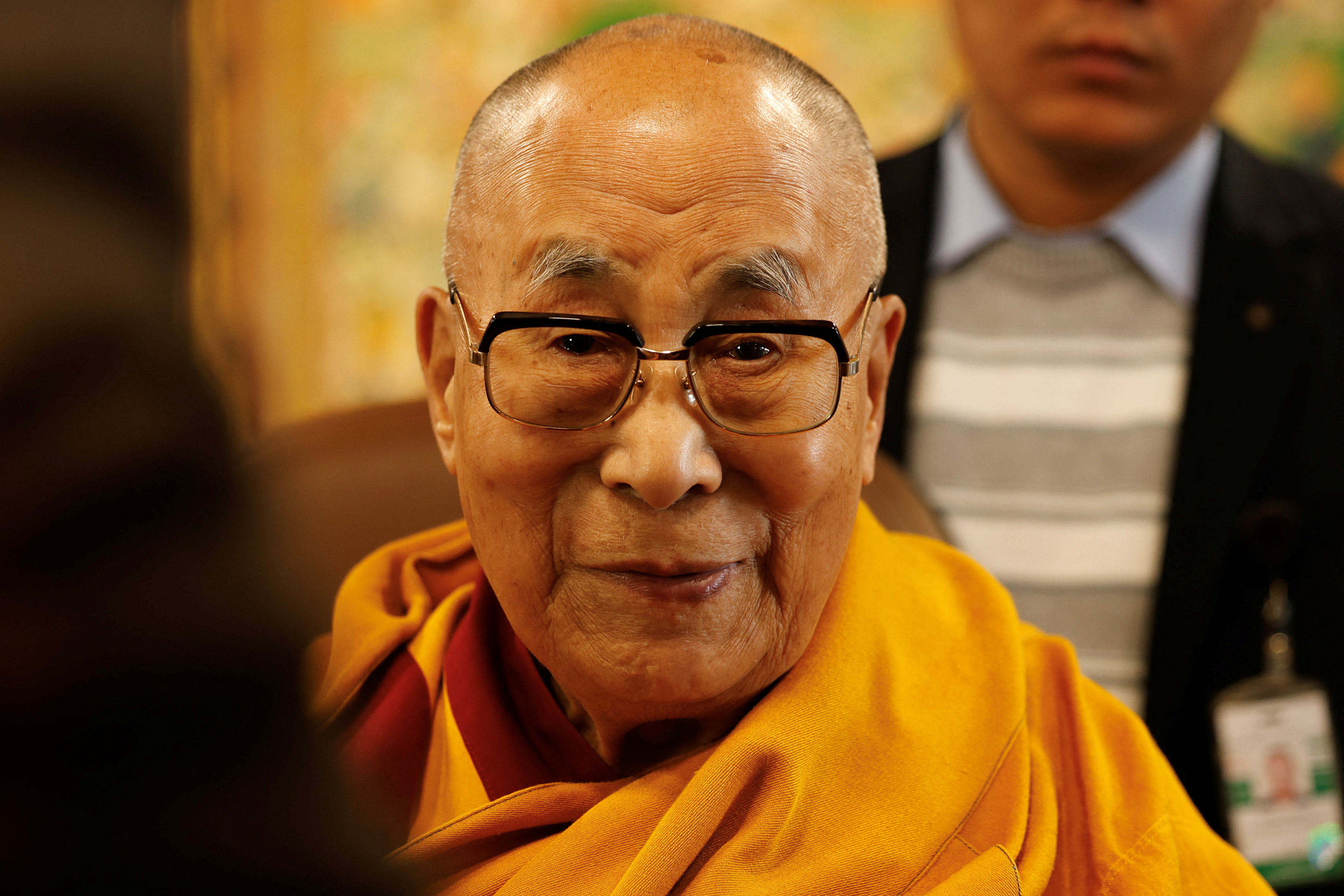 Tibetan spiritual leader, the Dalai Lama, offers blessings to his followers at his Himalayan residence in Dharamshala